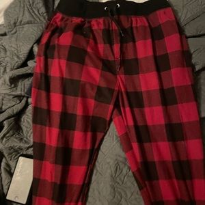 Red and black plaid sweats. Cuffed bottoms. Size medium